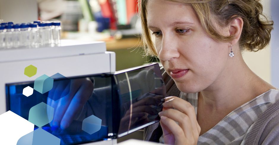 researcher examining equipment