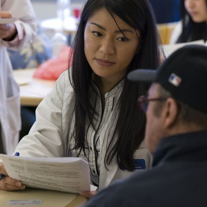student pharmacist with patient