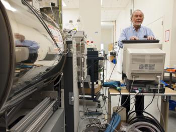 Burlingame with one of the facility's many spectrometers