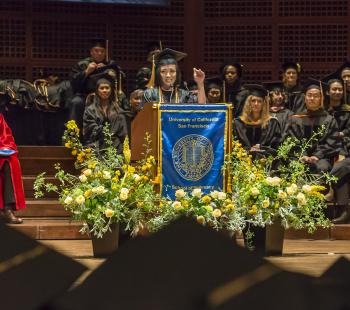 Academia at podium