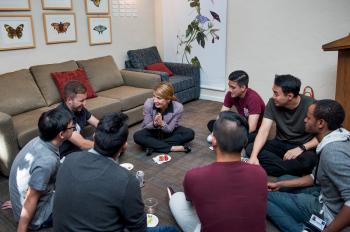 Jafari sitting in a circle with several students