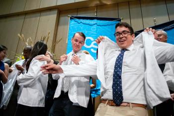 Dickinson and Diaz receive white coats
