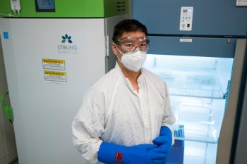 Abueg standing in front of freezer