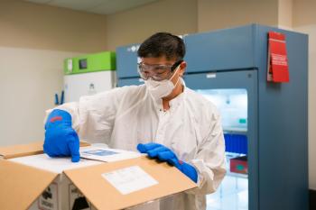 Abueg unpacking vaccine