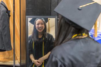Dinh looking in mirror