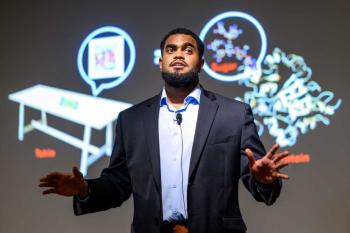 PhD student Reuben Hogan speaking
