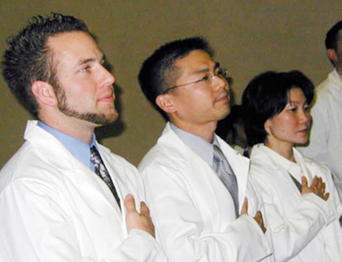 students taking the oath